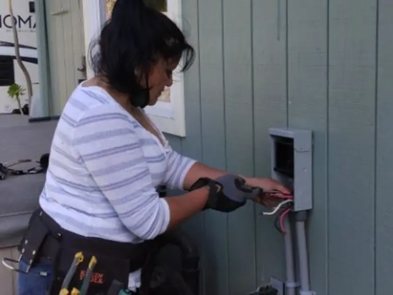 Licensed electrician wiring an exterior subpanel in El Dorado